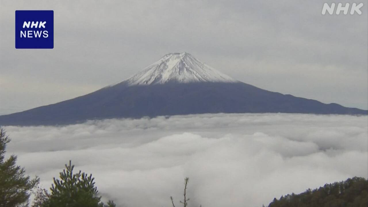 The top of Mount Fuji is whitened with snow