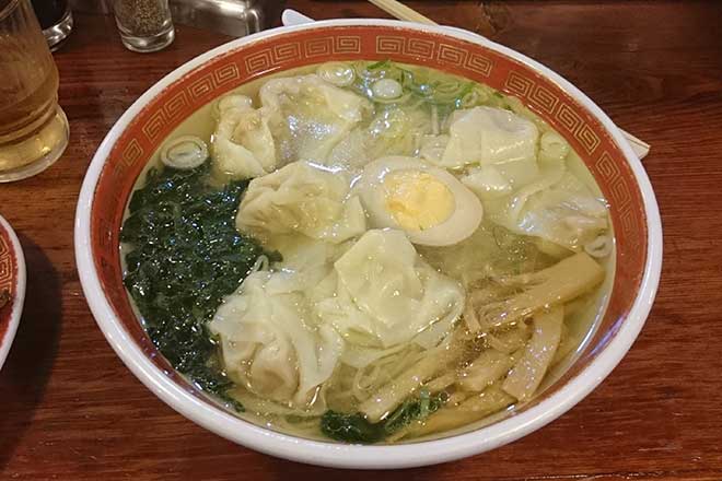ramen soup topped with fried wonton noodles