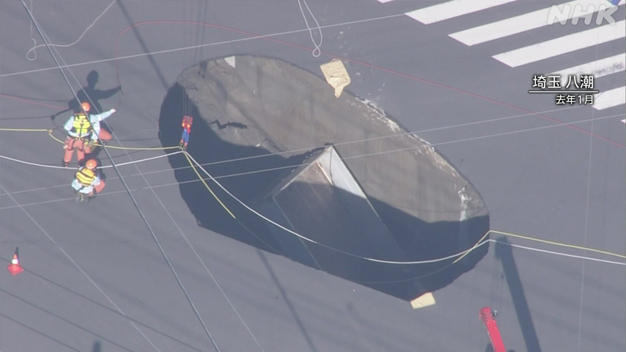 One year after a large hole in a road in Saitama Prefecture, work continues to fix it.
